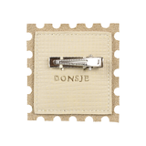Donsje Guar Clip Stamp Cream Scored Leather