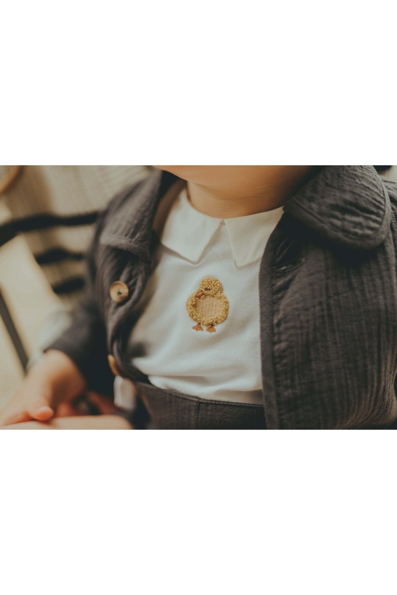 Scott Bodysuit - Duckling - Off White van Donsje Amsterdam | Kids Conceptstore Le Fanfare