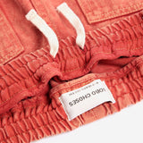 Taxi Saurus Tag twill pants - Red van Bobo Choses | Kids Conceptstore Le Fanfare