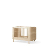 Wood Mini+ cot bed incl. junior kit, 68x122/162 cm, oak - new van Oliver Furniture | Kids Conceptstore Le Fanfare