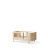 Wood Mini+ cot bed incl. junior kit, 68x122/162 cm, oak - new van Oliver Furniture | Kids Conceptstore Le Fanfare