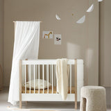 Wood Mini+ cot bed incl. junior kit, 68x122/162 cm, white/oak van Oliver Furniture | Kids Conceptstore Le Fanfare