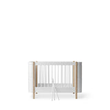 Wood Mini+ cot bed incl. junior kit, 68x122/162 cm, white/oak van Oliver Furniture | Kids Conceptstore Le Fanfare